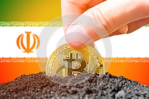 Legalization of bitcoin in Iran. Landing bitcoin in the ground against the background of the flag of Iran. Iran -