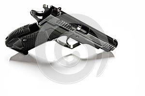 The legalization of weapons. Black traumatic gun on a white background photo