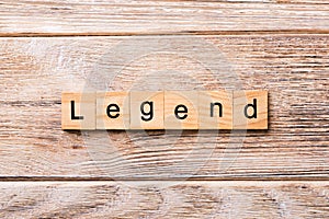 Legend word written on wood block. legend text on wooden table for your desing, concept