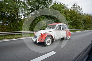 The legendary beetle Citroen retro car is a very rare car on the highway in Belgium.