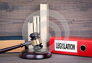 Legislation. Wooden gavel and books in background. Law and justice concept photo