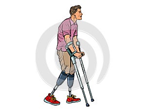Legless veteran with a bionic prosthesis with crutches. a disabled man learns to walk after an injury. rehabilitation photo