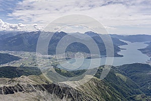 Legnone peak range and Colico village on northern part of Lario lake, Italy