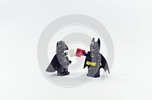 Lego batman and darth vader having drink together