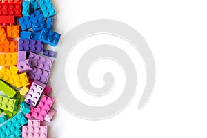 Lego bricks background. A lot of Colorful Plastick constructor bricks on white background. Popular toys. Copyspace