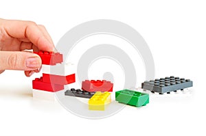 Lego bricks with hand photo