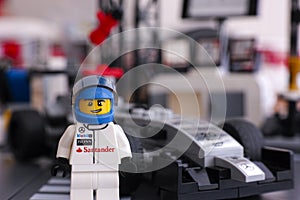 Lego McLaren Mercedes driver standing in front of his car