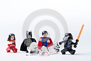 LEGO minifigure Batman, Superman, Stormtrooper and darth vader.