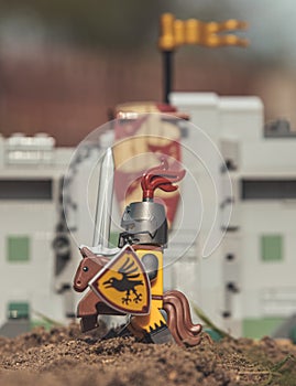 Lego minifigure of medieval knight on little horse