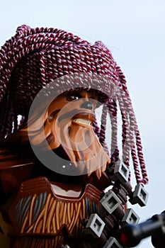 LEGO Star Wars action figure of Wookie Chewbacca with his crossbow and handmade knitted purple winter cap looking like dreadlocks.