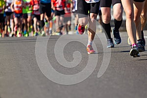 Legs of athletes running half marathon in Kyiv