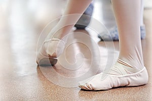 the legs of a ballerina girl. Studying at the Ballet School