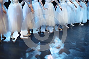 Legs of ballet dancers corps de ballet in pointe shoes photo