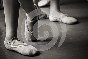 Legs in ballet slippers photo