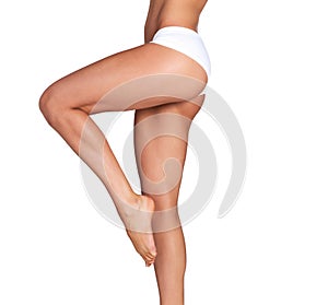 Legs, beauty and woman with mockup in studio for skincare, smooth and soft perfection on white background. Feet, leg and