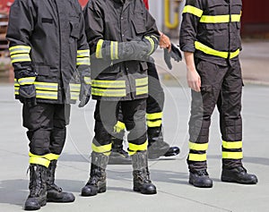 Legs with boots of firemen after rescue mission
