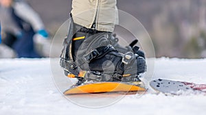 Legs in boots on snowboard