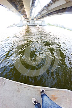 Legs on the bridge edge