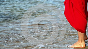 Legs close up. island of Phu Quoc. Traces of legs on sand. Woman feet and legs walking on beach