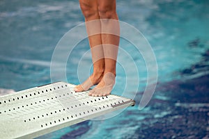 Legs on a diving board photo