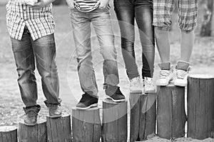 Legs and feet of teenage boys and girls outdoor black and white