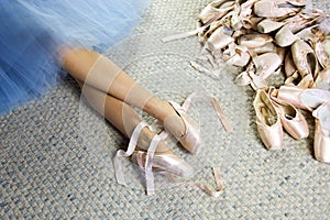 Legs of female ballet dancer lying with pointe shoes