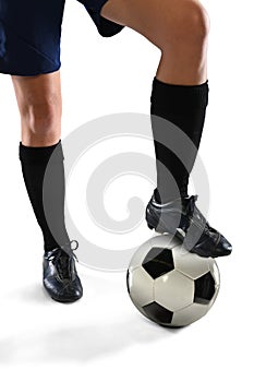 Legs of Female Soccer Player Stepping on Ball