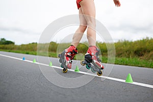 Legs of girl having roller skate exercise