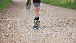 Legs of girl in sport shoes