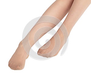 Legs of a girl in transparent tights isolated on a white background