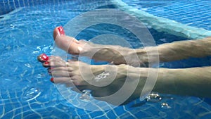 Legs of girls in the pool, relax