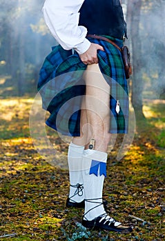 Legs of the man in kilt