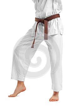 The legs of a man in a kimono. Isolated on white background.