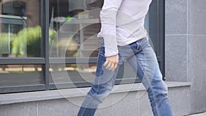 Legs of Man Leaving Outside Office Window