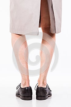 Legs of man in raincoat