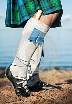 Legs of man in scottish kilt