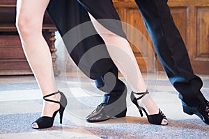 Legs of man and woman dancing Argentine tango