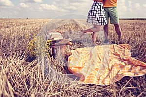 Legs of man and woman in the fields