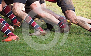 Legs of men playing rugby union