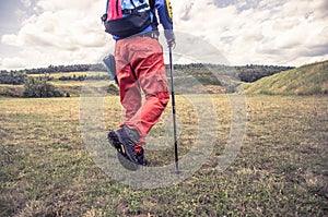 Legs of mountaineers walk in the mountain