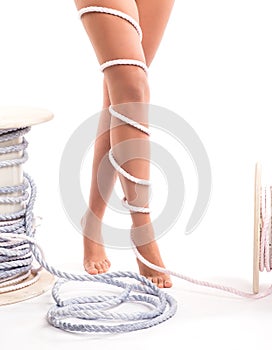 Legs pain concept - legs tied with rope isolated