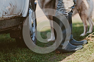 Legs in rubber boots close-up