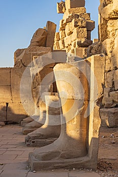 Legs of a ruined statue at the Karnak Temple complex in Luxor