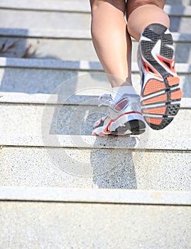 Legs running up on mountain stairs