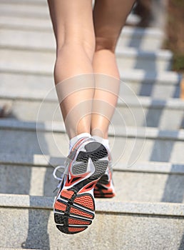 Legs running up on mountain stairs