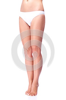 Legs of girl isolated on white background