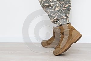 legs of a soldier in shoes