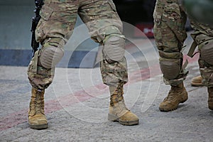 Legs of soldiers in camouflage