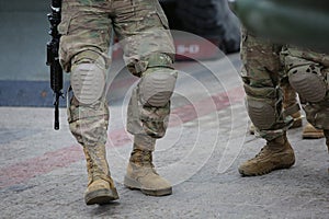 Legs of soldiers in camouflage