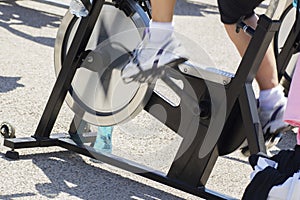 Legs in training during a spinning session